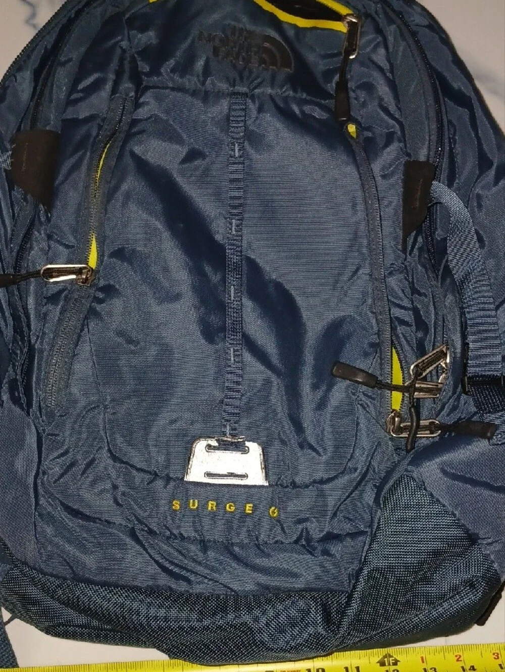 The North Face Navy Blue Backpack with Yellow Accents